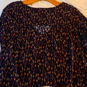 Short with peek a boo back slit very small slit